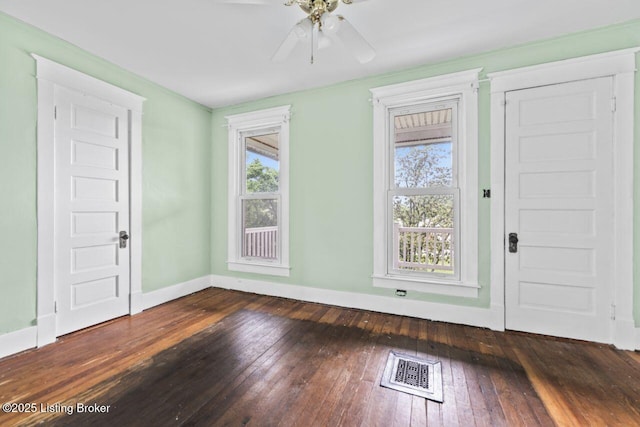 1412 Bluegrass Ave, Louisville, KY 40215 - entryway featuring baseboards, visible vents, a ceiling fan, and dark wood-type flooring