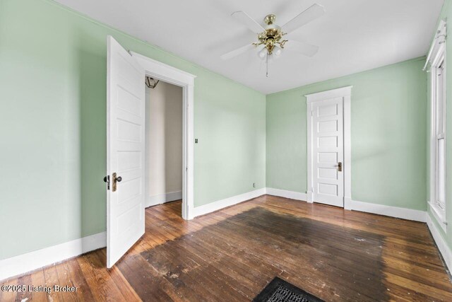 1412 Bluegrass Ave, Louisville, KY 40215 - unfurnished bedroom featuring ceiling fan, baseboards, and hardwood / wood-style floors
