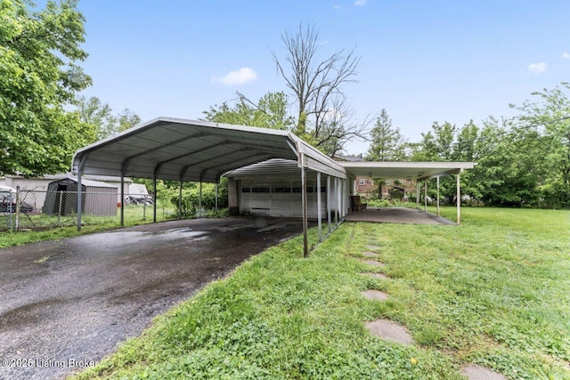 1412 Bluegrass Ave, Louisville, KY 40215 - view of parking / parking lot featuring fence and a detached garage