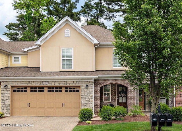 10243 Dorsey Pointe Cir, Louisville, KY 40223 - view of front of home featuring driveway, roof with shingles, stone siding, and an attached garage