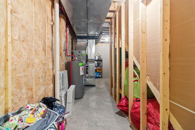 unfinished basement featuring water heater