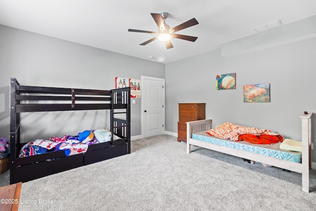 bedroom featuring carpet flooring, a ceiling fan, and baseboards