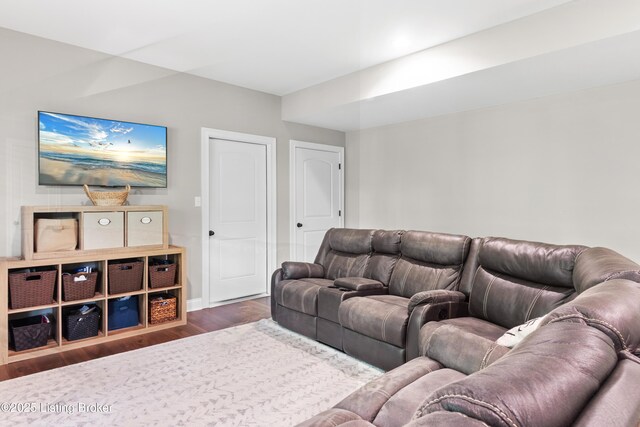 living room featuring wood finished floors and baseboards