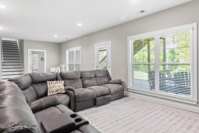 living area with stairway and recessed lighting