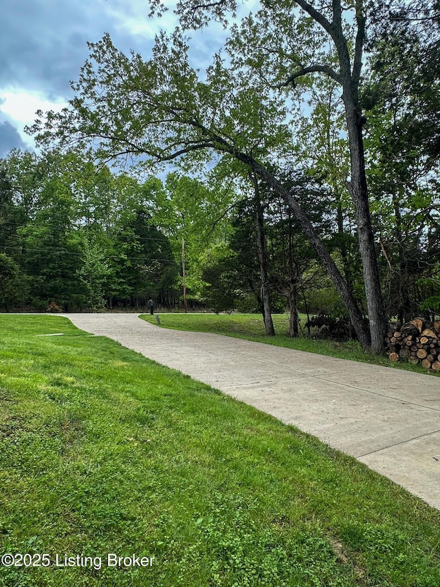 surrounding community featuring a lawn