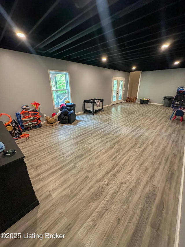 playroom featuring wood finished floors, baseboards, and recessed lighting