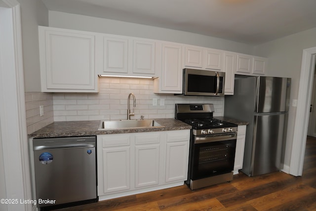 1024 Berry Blvd, Louisville, KY 40215 - kitchen featuring stainless steel appliances, a sink, white cabinets, and tasteful backsplash
