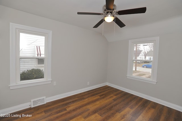 1024 Berry Blvd, Louisville, KY 40215 - empty room with baseboards, dark wood-style flooring, vaulted ceiling, and ceiling fan