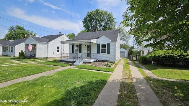 1024 Berry Blvd, Louisville, KY 40215 - bungalow with a front yard, a garage, roof with shingles, and covered porch
