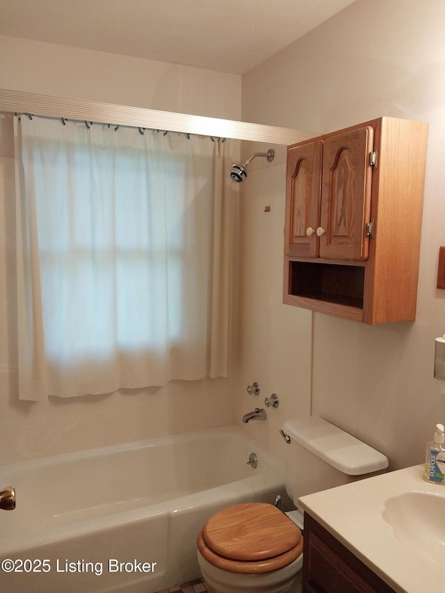 full bathroom with toilet, vanity, and shower / washtub combination
