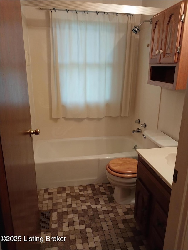 full bath featuring vanity, toilet, and shower / tub combination