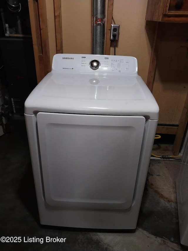 clothes washing area featuring washer / dryer and laundry area
