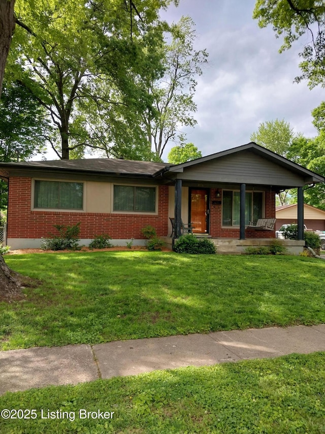 single story home with a front yard, a porch, and brick siding