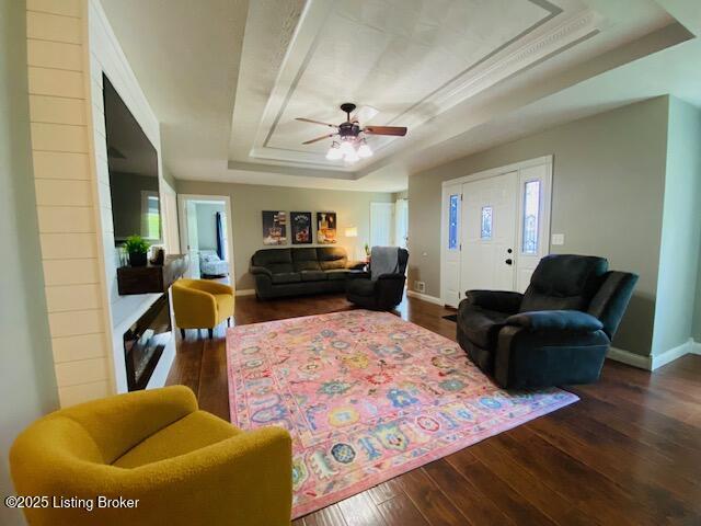 1300 Midway Ln, Springfield, KY 40069 - living room with a raised ceiling, wood-type flooring, a ceiling fan, and baseboards