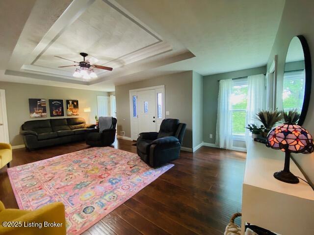 1300 Midway Ln, Springfield, KY 40069 - living area with a tray ceiling, healthy amount of natural light, and wood finished floors