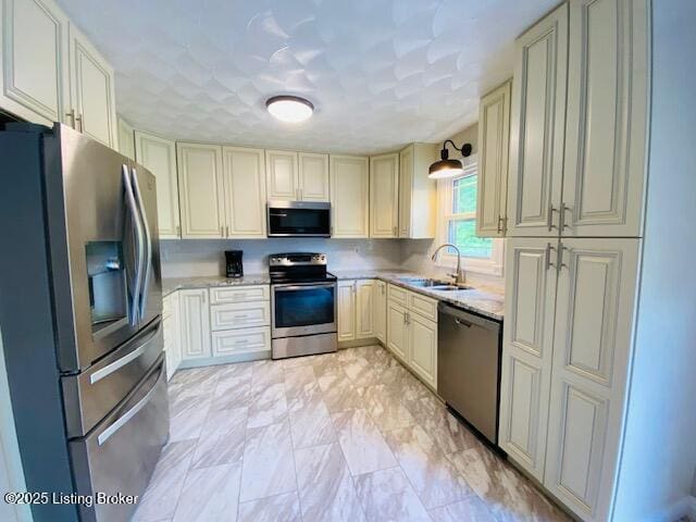 1300 Midway Ln, Springfield, KY 40069 - kitchen with stainless steel appliances, cream cabinetry, and a sink
