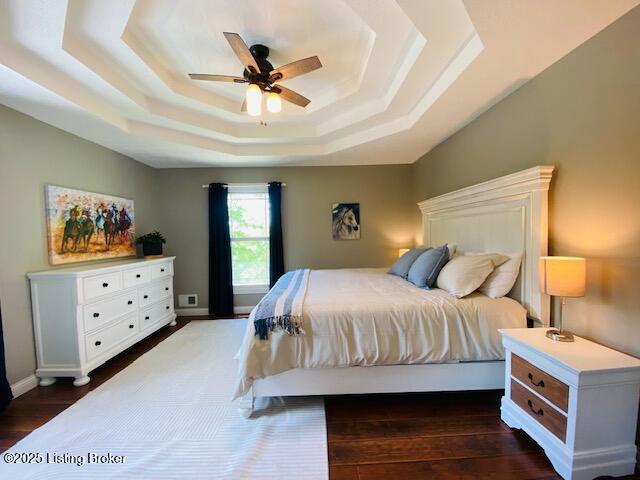 1300 Midway Ln, Springfield, KY 40069 - bedroom featuring a raised ceiling, dark wood-type flooring, and ceiling fan