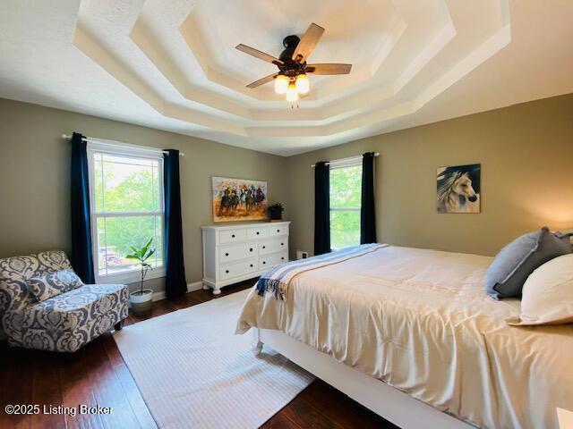 1300 Midway Ln, Springfield, KY 40069 - bedroom featuring a raised ceiling, wood finished floors, and a ceiling fan