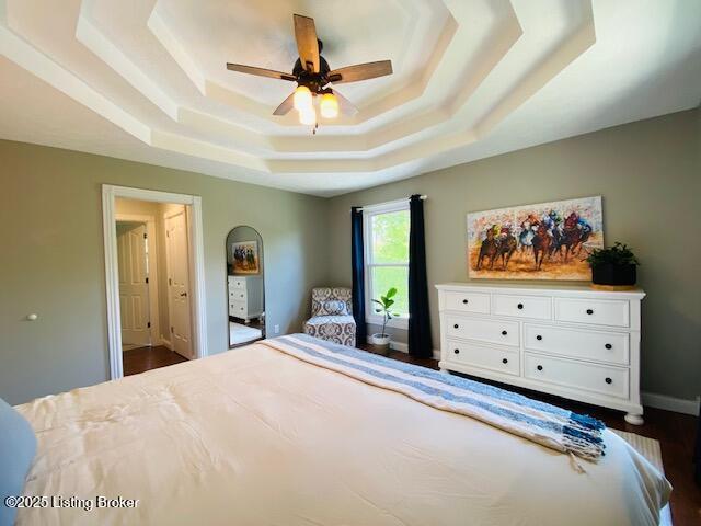 1300 Midway Ln, Springfield, KY 40069 - bedroom featuring a raised ceiling, dark wood-style flooring, baseboards, and ceiling fan