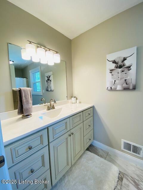 1300 Midway Ln, Springfield, KY 40069 - bathroom featuring vanity and baseboards