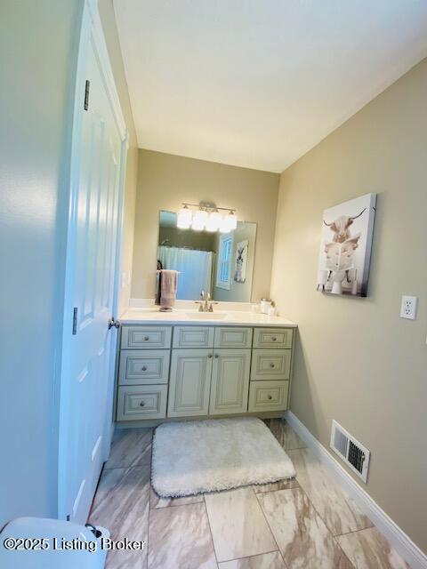 1300 Midway Ln, Springfield, KY 40069 - bathroom with vanity and baseboards