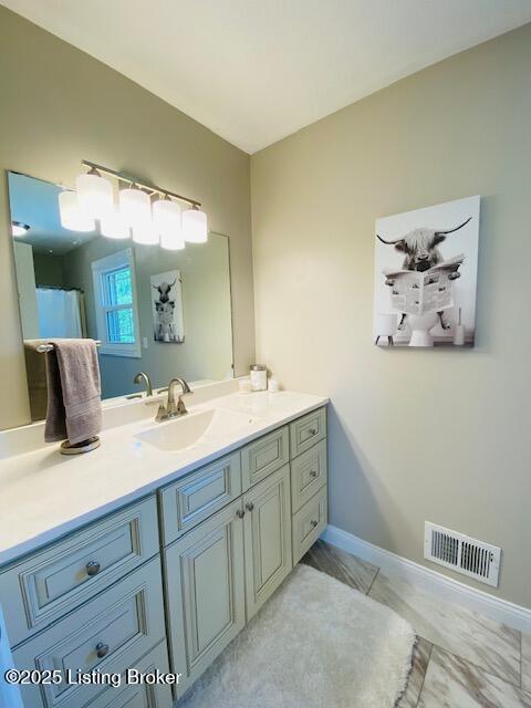 1300 Midway Ln, Springfield, KY 40069 - bathroom with vanity and baseboards