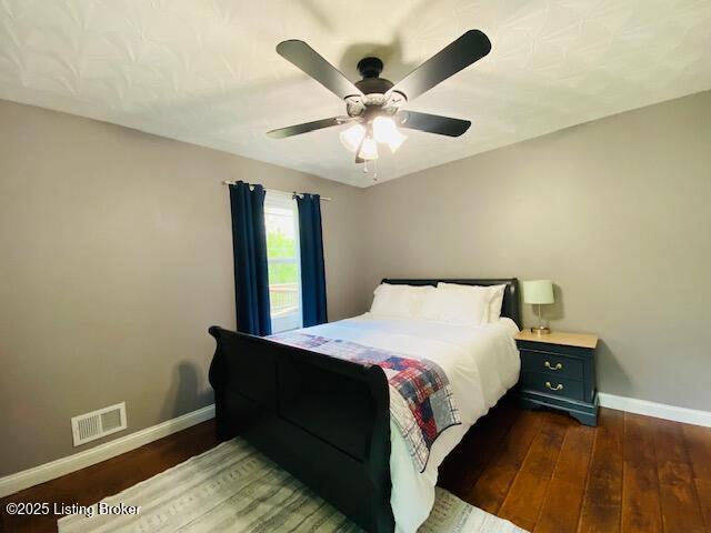 1300 Midway Ln, Springfield, KY 40069 - bedroom with baseboards, dark wood-style floors, and a ceiling fan