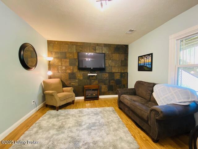 1300 Midway Ln, Springfield, KY 40069 - living room featuring baseboards and wood finished floors