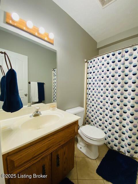 1300 Midway Ln, Springfield, KY 40069 - full bath featuring tile patterned floors, vanity, and toilet