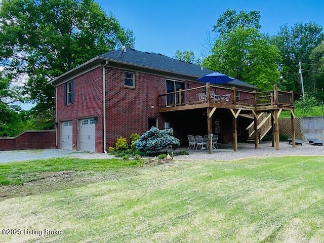 1300 Midway Ln, Springfield, KY 40069 - back of house featuring a wooden deck, stairs, a garage, a lawn, and brick siding