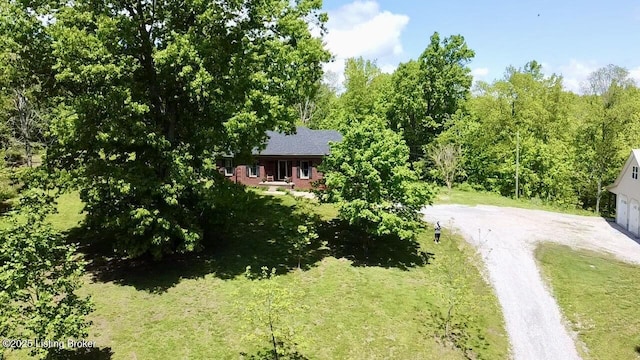 1300 Midway Ln, Springfield, KY 40069 - view of grassy yard featuring a garage and driveway