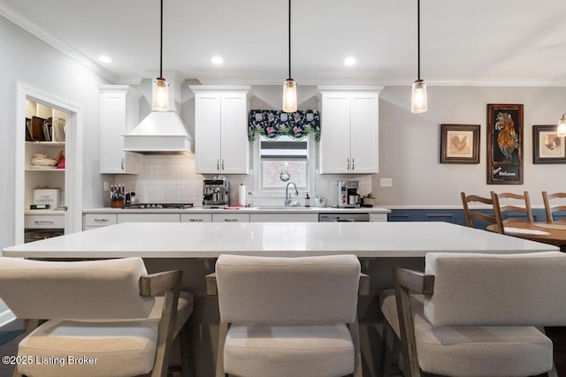 2421 Irish Bend Ct, Fisherville, KY 40023 - kitchen featuring a sink, crown molding, stainless steel gas stovetop, premium range hood, and tasteful backsplash
