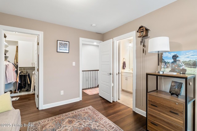 2421 Irish Bend Ct, Fisherville, KY 40023 - bedroom with baseboards, dark wood finished floors, a closet, and a walk in closet