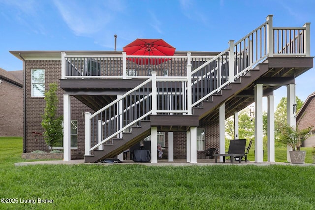 2421 Irish Bend Ct, Fisherville, KY 40023 - back of property featuring brick siding, a deck, a lawn, and stairs