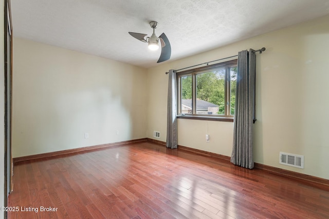 1509 Glenrock Rd, Louisville, KY 40216 - empty room featuring ceiling fan, wood finished floors, baseboards, and a textured ceiling