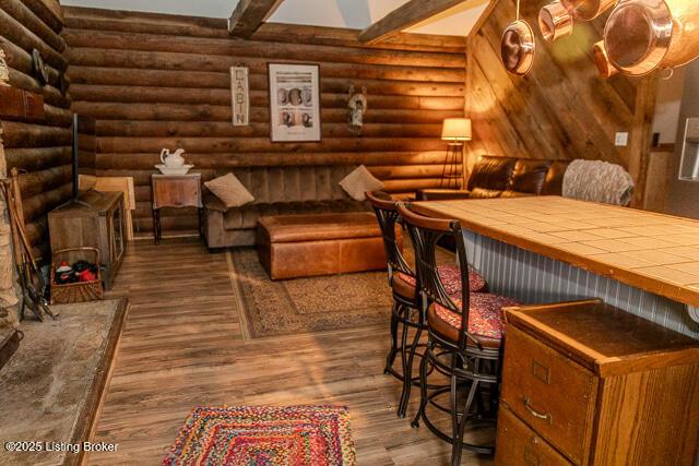 interior space with rustic walls and wood finished floors