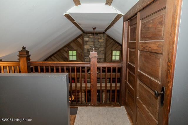 wine cellar featuring lofted ceiling