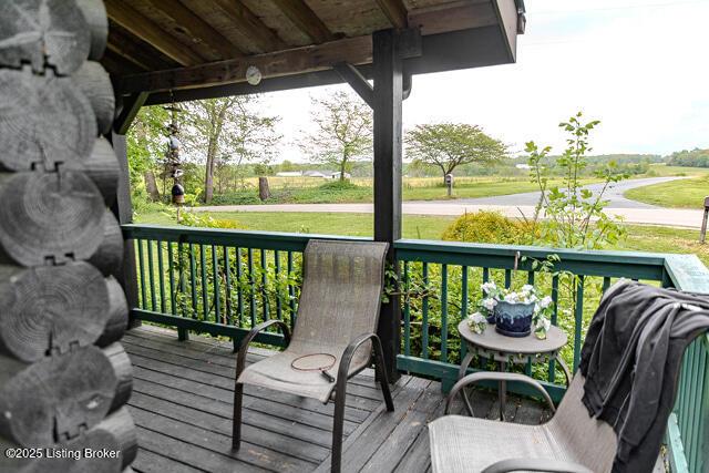 wooden terrace featuring covered porch