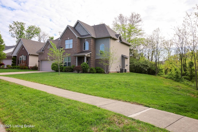 803 Urton Woods Way, Louisville, KY 40243 - view of front facade with a front lawn, central AC unit, concrete driveway, and brick siding