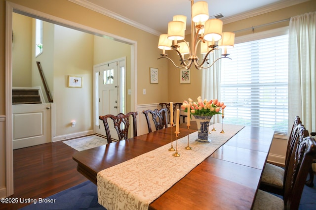 803 Urton Woods Way, Louisville, KY 40243 - dining area featuring plenty of natural light, a chandelier, crown molding, wood finished floors, and stairs