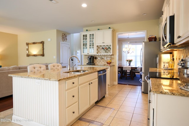 803 Urton Woods Way, Louisville, KY 40243 - kitchen featuring a sink, appliances with stainless steel finishes, backsplash, light tile patterned floors, and glass insert cabinets
