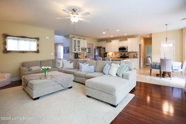 803 Urton Woods Way, Louisville, KY 40243 - living area featuring light wood finished floors, ceiling fan, a chandelier, recessed lighting, and baseboards
