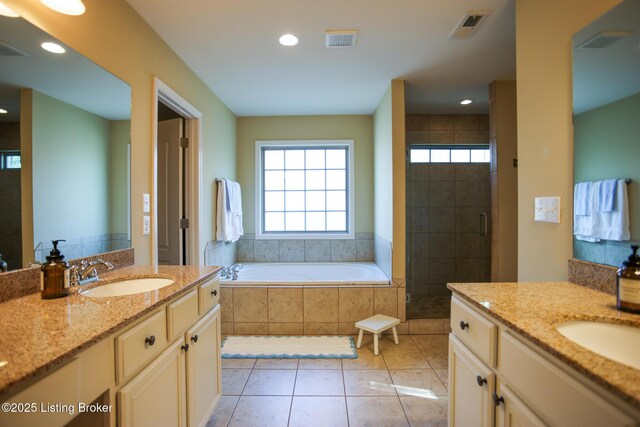 803 Urton Woods Way, Louisville, KY 40243 - bathroom with a garden tub, a stall shower, two vanities, recessed lighting, and tile patterned flooring