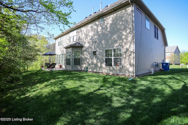 803 Urton Woods Way, Louisville, KY 40243 - rear view of property with a lawn and a patio area