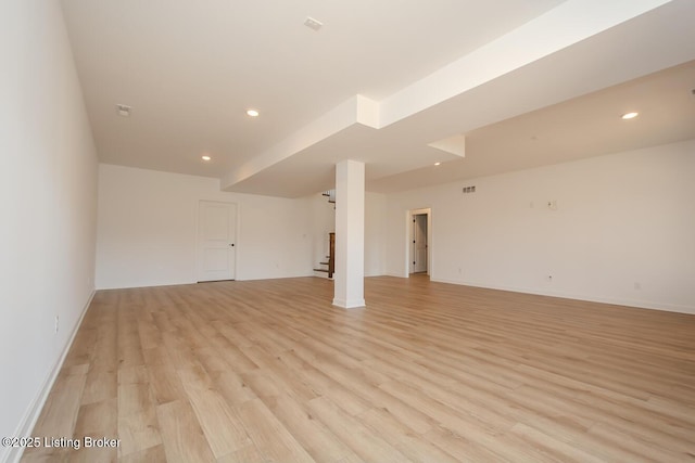 interior space with stairway, light wood finished floors, and recessed lighting