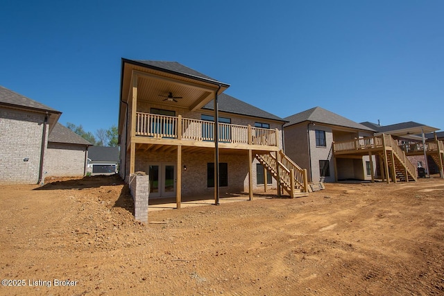 back of property featuring stairway, a wooden deck, and ceiling fan