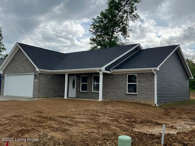 5415 Mount Holyoke Dr, Louisville, KY 40216 - ranch-style home with an attached garage, brick siding, roof with shingles, and driveway