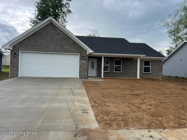 5415 Mount Holyoke Dr, Louisville, KY 40216 - ranch-style home featuring concrete driveway and a garage