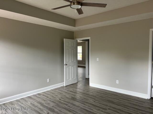 5415 Mount Holyoke Dr, Louisville, KY 40216 - empty room featuring dark wood finished floors, baseboards, and ceiling fan