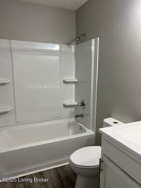 5415 Mount Holyoke Dr, Louisville, KY 40216 - full bath featuring wood finished floors, toilet, vanity, and shower / bath combination